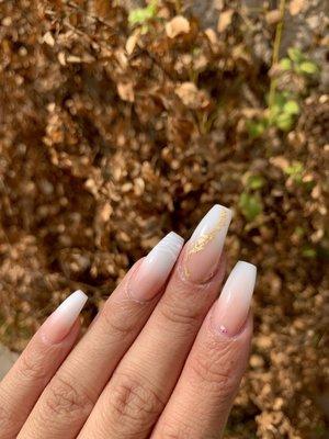 Ask for a full set of acrylic nude and white ombré with gold foil