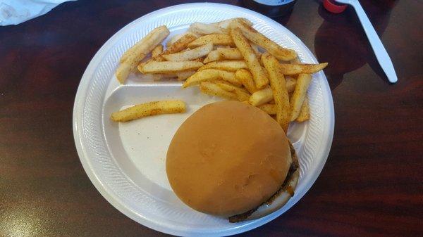 Sliced bbq sandwich and seasoned fries.