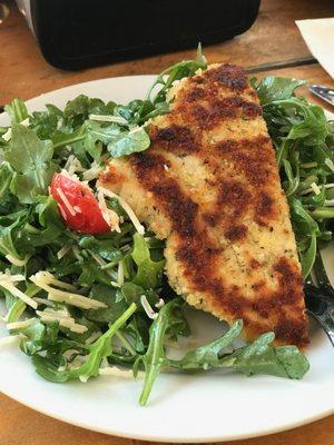 PARMESAN-CRUSTED CHICKEN ARUGULA
 Sautéed chicken breast crusted with grated Parmesan and panko bread crumbs, topped with fresh arugu