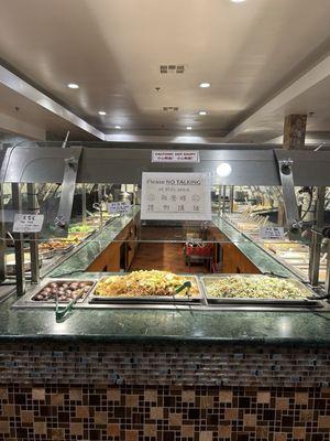 The hot bar -- Fried noodles Enoki Mushroom, Fried Rice w/ Spinach, hot soup, and cold appetizers.