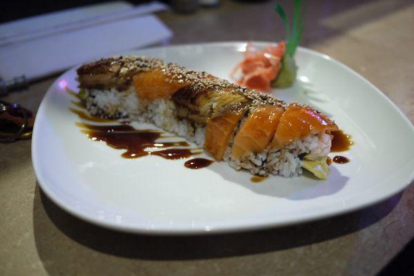 Tiger Rolls ($6.95) California roll topped with salmon and eel