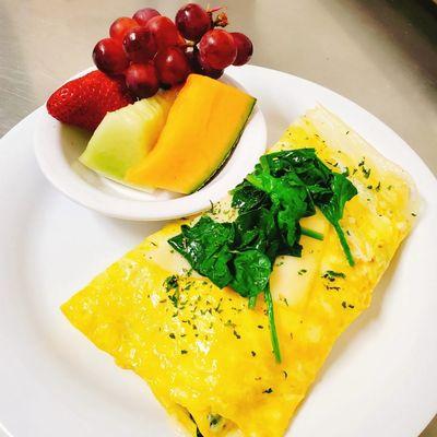 Spinach omelet with a side of fruit