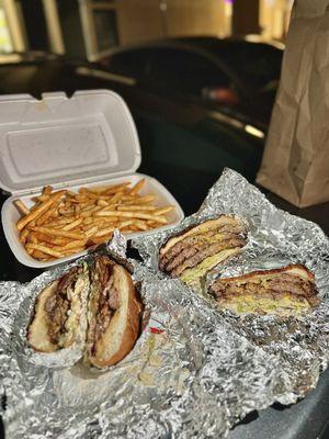 Left: Double Burger w/ Beef Bacon, Right: The Triple Burger, Back: Cajun Side O' Fries