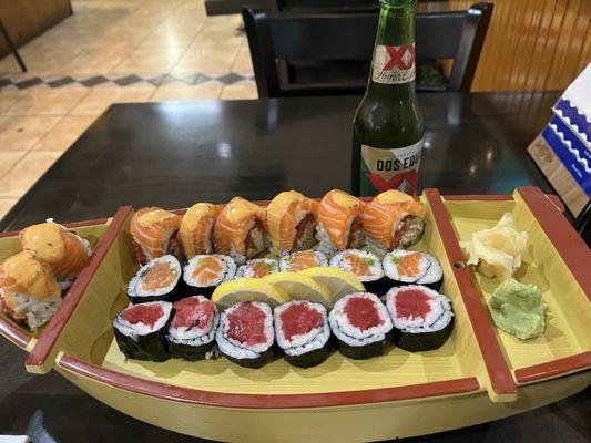 One specialty roll and two regular rolls (salmon and tuna).