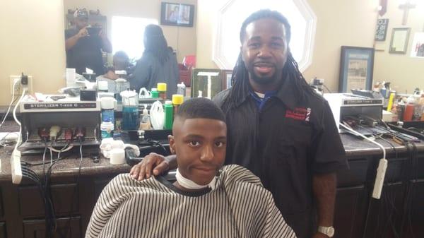 My son and his new barber.