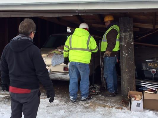 Notice that the peak of the roof is about 3 feet off the ground. It creaked and moaned when they jacked it up.