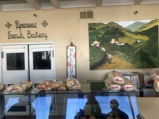 They sell full loaves French bread. Looked fake, but actually real bread on display case below