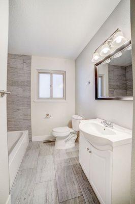 Full bathroom remodel in Rocklin, CA. Installed new toilet, bathroom vanity, mirrors, lighting, tile flooring, new bathtub.