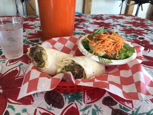 Steak and cheese wrap with pickles and side salad