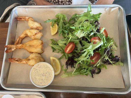 Shrimp in shorts with side salad.