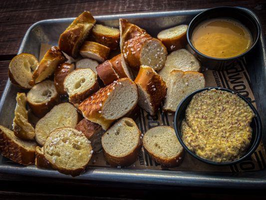 Dry nasty pretzel bites with enough beer cheese for maybe two.