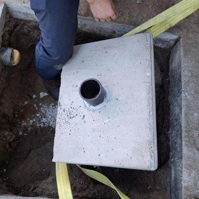 That block weighed over 200 pounds! We used special equipment to help lift it and place this storm drain box.