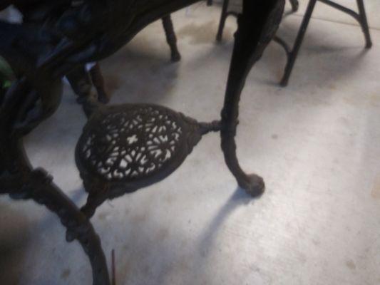 I have two antique tables about 100 years old. They are made of wood and one table has rod iron legs and the other has a face on legs.