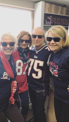 Nancy (optician), Karen (front desk), Dr. Andrade (optometrist) and Amanda (front desk) gleaming with Patriot's pride!