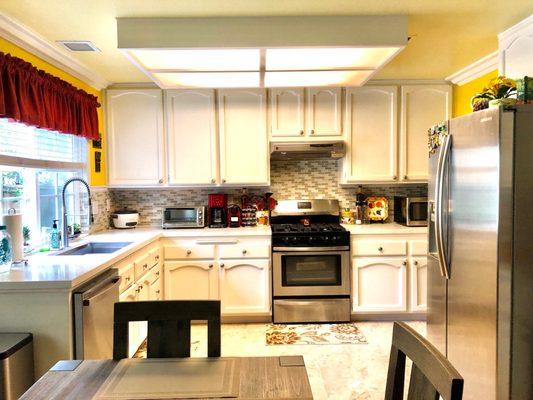 Kitchen and dining with new quartz countertops, sink and faucet