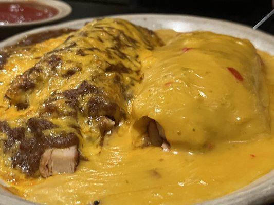 Burritos - one with chili & cheese; one with queso sauce