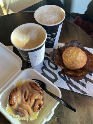 Lattes, cinnamon roll and muffin. Oh my!