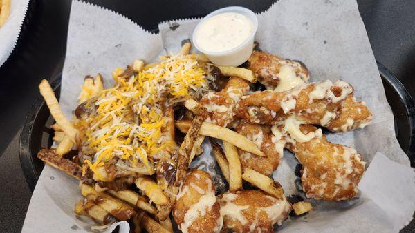 Garlic parm traditional wings with poutine fries.