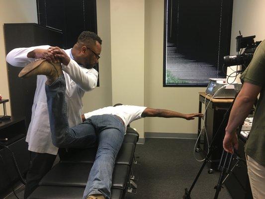 Dr Britton testing the strength of our patients psoas muscle