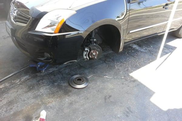 Resurfacing the rotors before installing it back in with new  oe brake pads