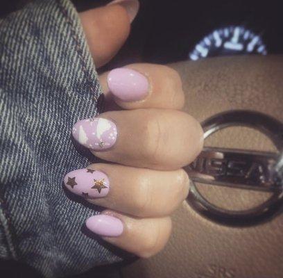 Pink nails with clouds, stars and crystals