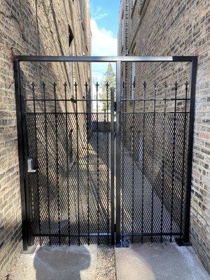 Custom fabricated security gate between buildings.