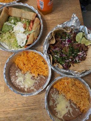 Carne asada tacos, rice and beans, beef flautas