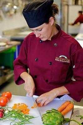 Escoffier student demonstrating proper knife skills  during the Culinary fundamentals course.