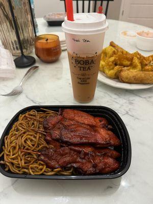 Teriyaki chicken on a stick with lo mein noodles