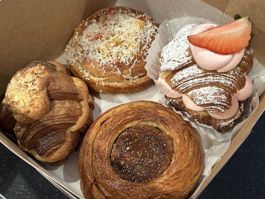 Almond croissant, sausage pepperonata, strawberry milk croissant, forgot what's the last one (Italian holiday cookie or something)