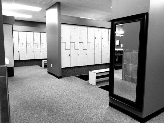 Large men and women's locker rooms with over 100 lockers in each.