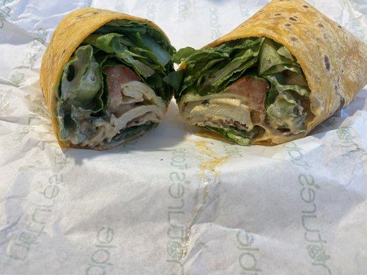 Extra Romain lettuce, pepper Jack cheese, Turkey,supposed to be no tomato and chipotle on the side but it's in the wrap