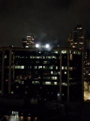 Bad neighbor that has installed high intensity flood lights pointed directly at a residential building.