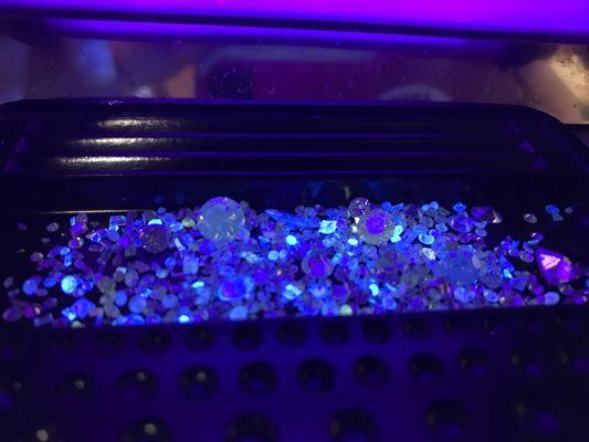 Loose diamonds under UV light.