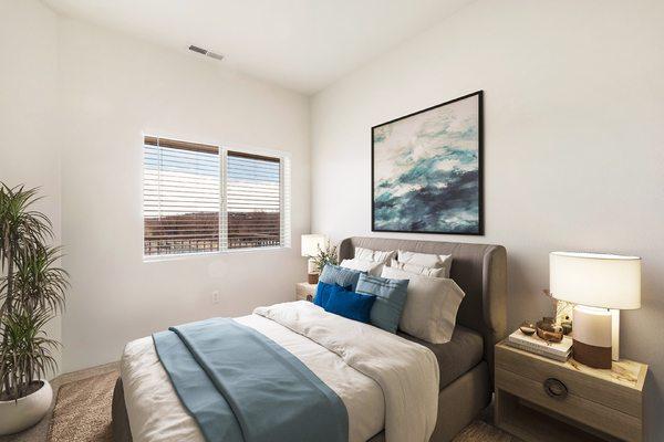 Shoreline Village Apartments in Richland, WA - Bedroom with bright natural light, new carpet and white walls.