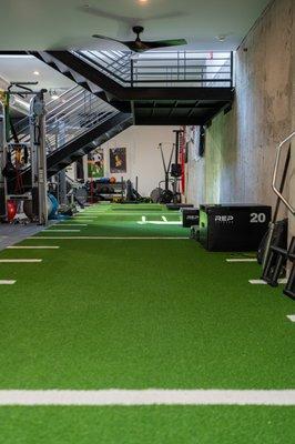 Here's a look at our turf where we do a majority of our sports performance training including mobility work, speed training and plyometrics