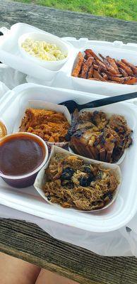 BBQ Trio w/ Pulled Chicken, Boneless Ribs, & Beef Brisket. Sides are Potato Salad & Sweet Potato Fries w/ cinnamon sugar