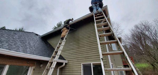 The crew installing your Gutters.