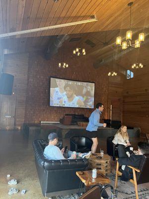 The TV and stage area in the second building. Great place to watch a game