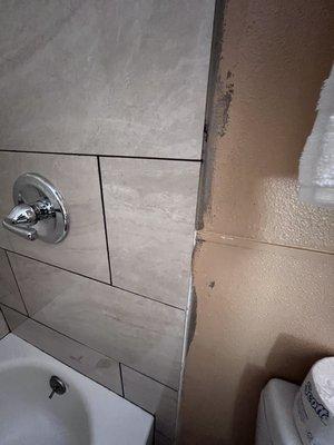 Paint behind shower surround