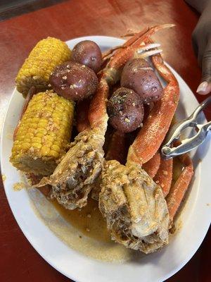 Snow Crab Legs with potatoes and Boiled Corn on the Cob