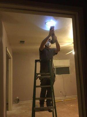 Adding recessed lighting.