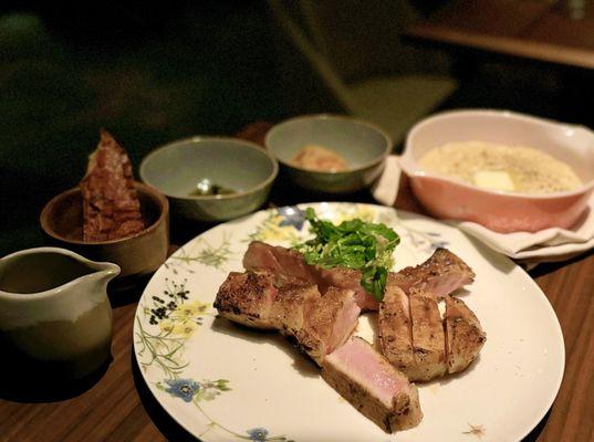 12 oz Dry Aged Pork Chop w/ fermented stone fruit bbq, herb salad, hominy grits, kimchi, pickled okra, country ham | $54