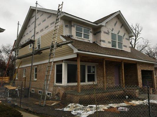 Completed roof, & partial James Hardie siding installation.