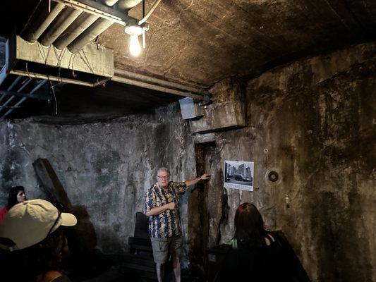 Daniel telling us about the telegraph pole embedded in the wall beneath the streets.