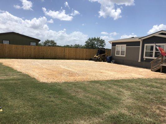 Extended and raised gravel pad for parking