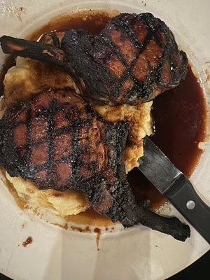 Charred black forged in fire pork chops.