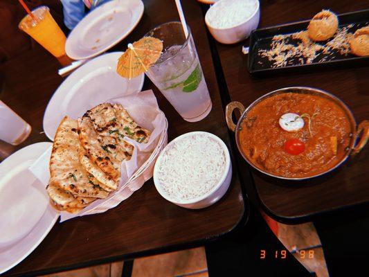 Goat curry with rice and a side of garlic naan 10/10. Garlic naan is to die for!