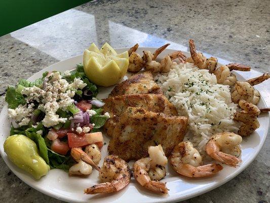 Tilapia and shrimp with rice and salad