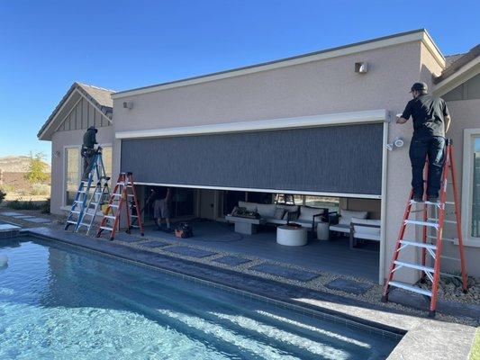 A giant 24 foot wide side track patio shade